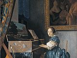 London National Gallery Next 20 11 Jan Vermeer - A Young Woman seated at a Virginal Jan Vermeer - A Young Woman seated at a Virginal, 1670-2, 51.5 x 45.5 cm. The young woman seems to look at us as we enter the room, but keeps on playing the virginal (a keyboard instrument similar to a harpsichord). Propped against the virginal in the left foreground is a viola da gamba with the bow placed in between the strings. The virginal has a landscape painted on the inside of the lid, and the painting in the background is The Procuress by Dirck van Baburen. A tapestry frames the scene at the upper left, and the skirting in the lower right is decorated with Delft tiles.